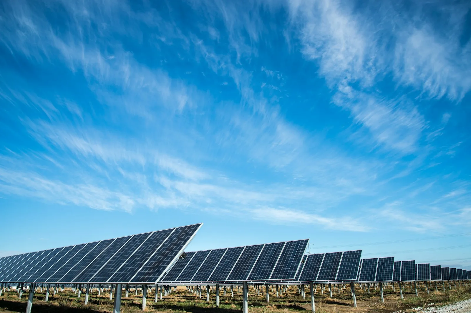 Solar panels under a clear blue sky.